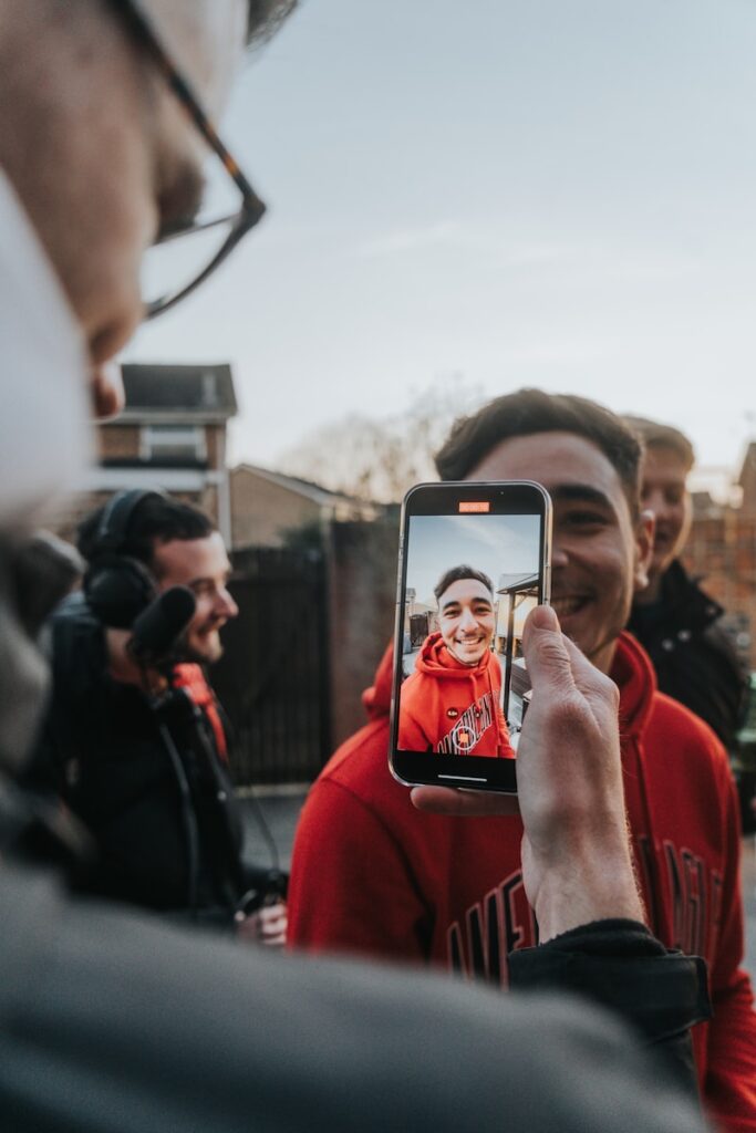 a man taking a picture of himself on his phone