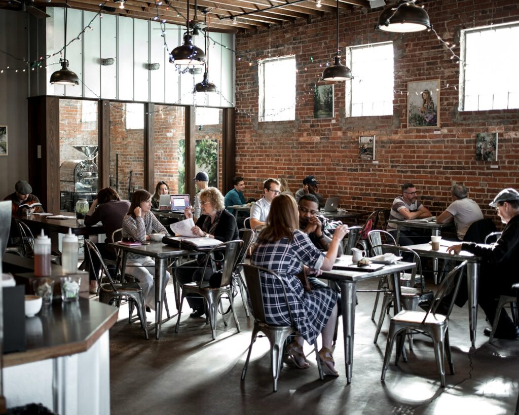 people sitting on restaurant chairs