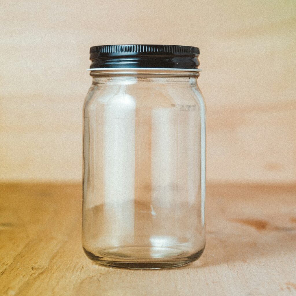 clear glass jar with white powder inside