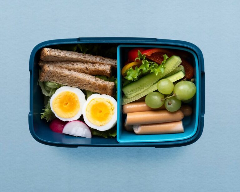 healthy-kids-food-lunchbox-with-egg-greens_53876-147470