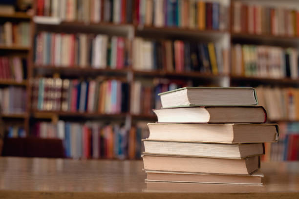 Close up of books on desk in library